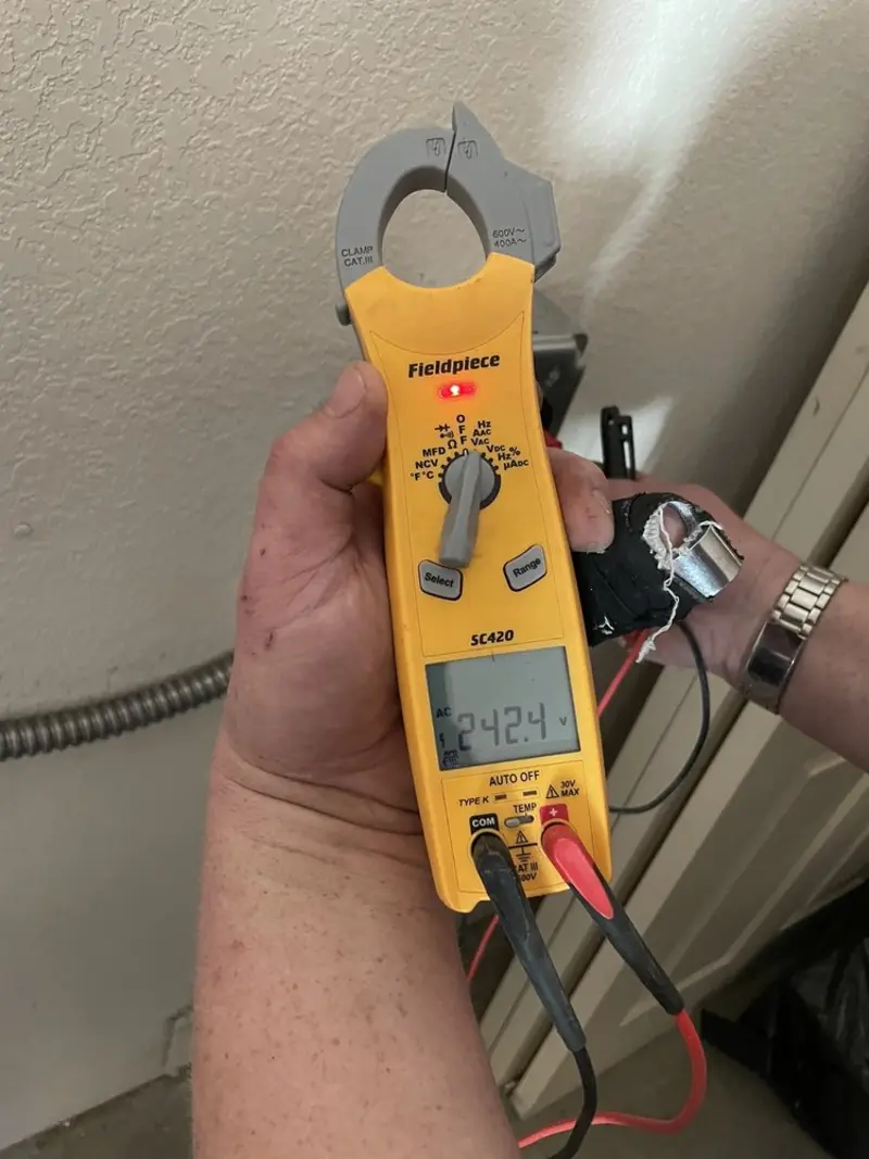 Voltage testing with clamp meter during Generator Installation in Franklin